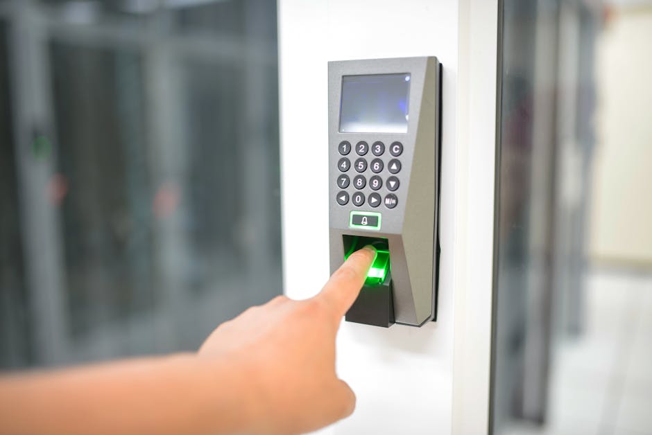 pexels photo 17155842 17155842 A person uses a fingerprint scanner for secure entry in a business setting.